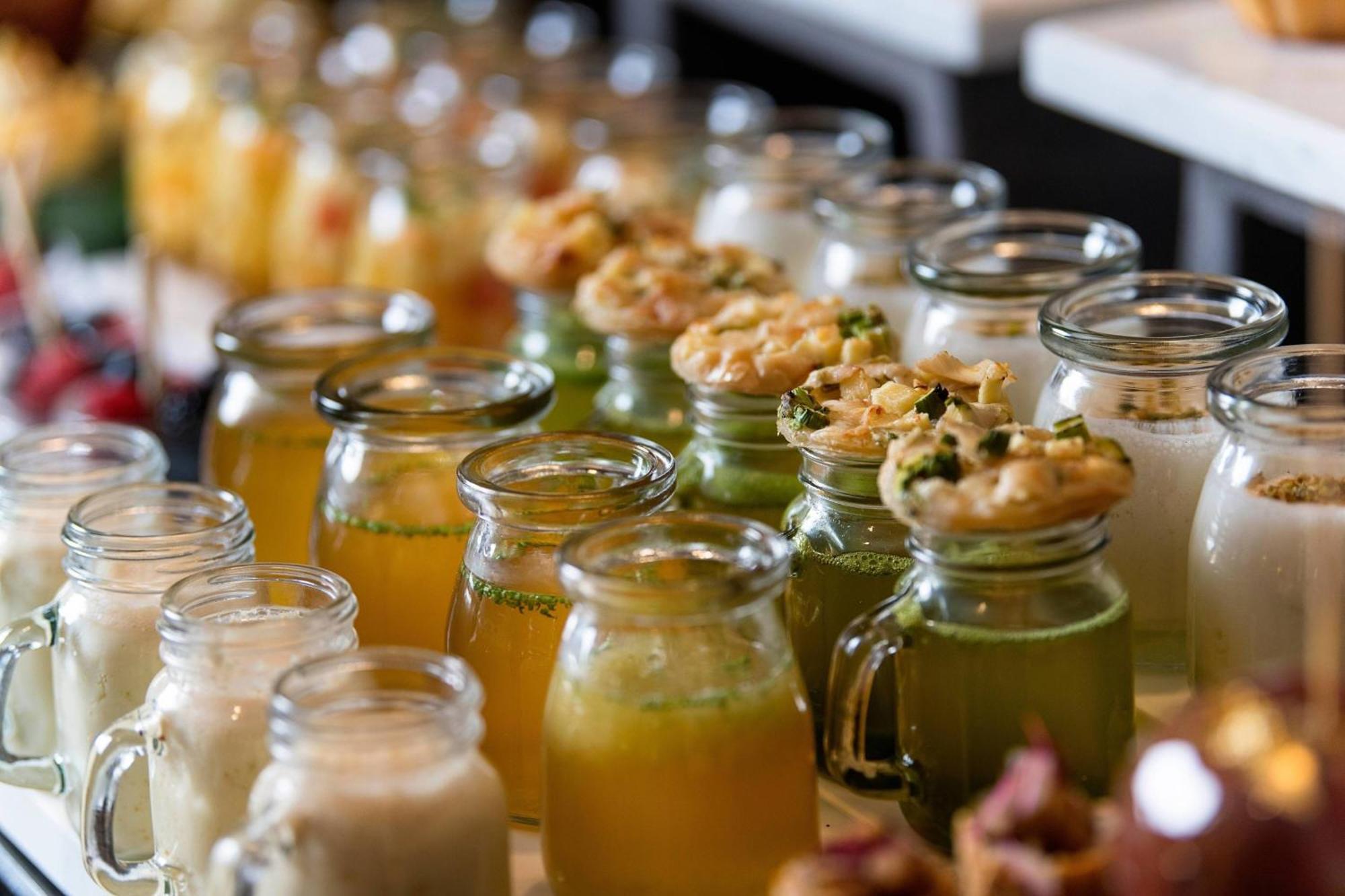 Sharq Village & Spa, A Ritz-Carlton Hotel Doha Ngoại thất bức ảnh A selection of fruit juices